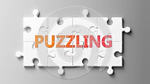 Puzzling complex like a puzzle - pictured as word Puzzling on a puzzle pieces to show that Puzzling can be difficult and needs