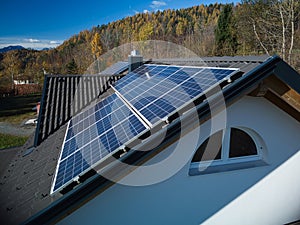 PV Panels on Dark Rooftop with Scenic Backdrop