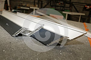 In a PVC joinery, blades laid for the construction of a window or a door photo