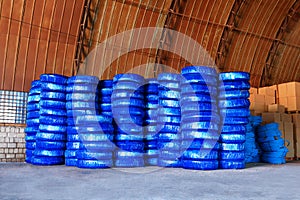 Pvc Plastic pipes stacked in a warehouse yard use plumbing or sewage installations on construction site, packed for shipping