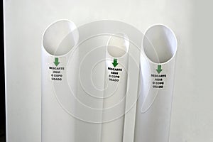 PVC or polyvinyl chloride cup trash collector water dispenser with the inscription discard the used cup here