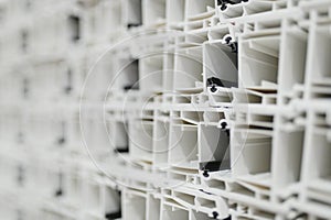 Pvc window frames stacked in warehouse, ready for installation