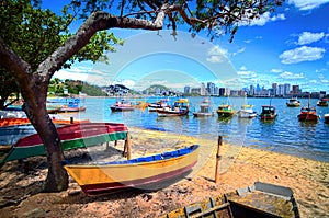 local wooden fishing boats in the shore photo