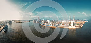 Panoramam aerial view of a container terminal at sunrise