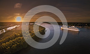 Aerial view of a cruise ship on the river Elbe at sunset in late summer