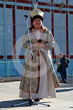 Woman sings the song. National Unity Day in Russia