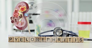 Pyelonephritis is written on cubes on the table in hospital