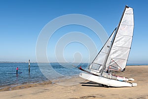 Pyla sur Mer, Arcachon Bay, France. Stand up paddle and catamarans on the beach