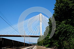 Pylon and cable stay tubes of Port Mann Bridge, white stay tubes, concrete column, industrial, metal, blue sky, white