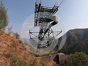 The pylon of the cableway that connects the towns of Albino and Selvino. Green painted pylons to camouflage them in the woods