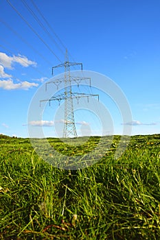 Pylon of the electricity power line on blue sky background.Electricity line. Power lines on blue sky background. High