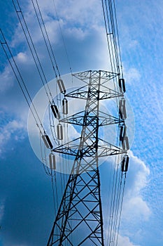 The pylon outline, Very High Voltage Power Lines Indonesia : SUTET on blue sky.