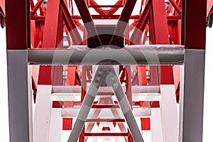Pylon, red and white painted steel tower. The fragments showing the details of construction, joins, rivets