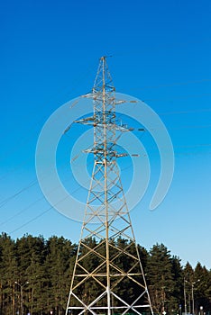 Pylon and transmission power line in sunset