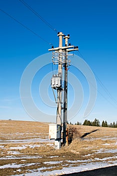 Pylon and transmission power line in winter