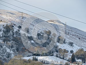 Pylons and cables on Esclusham Mountain Wales in Winter.