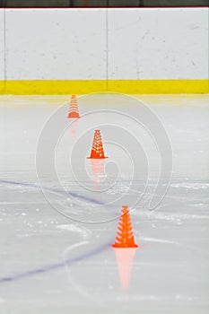 Pylons on the ice in an arena