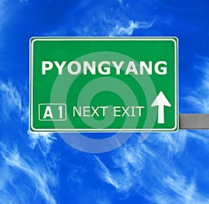 PYONGYANG road sign against clear blue sky