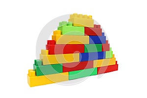 Pyramid assembled from the details of a multicolored bright constructor on a white isolated background