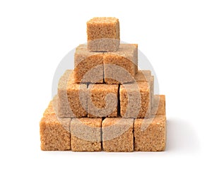 Pyramid of brown unrefined cane sugar cubes