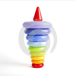 Pyramid build from colorful plastic rings, isolated on white.