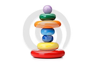 A pyramid build from rings, isolated on a white background. Colorful wooden toys for babies. Learning child pyramid toy.