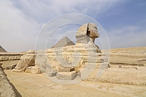 The pyramid of Chephren with a statue of a sphinx in the foreground