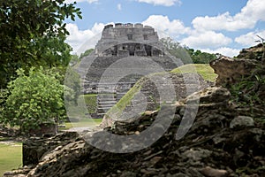 Pyramid `El Castillo` behind smaller Maya ruins at the archeological site Xunantunich near San Ignacio, Belize