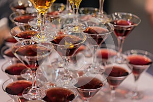 Pyramid of glasses with beverages, wine, champagne, festive mood, celebration, holiday