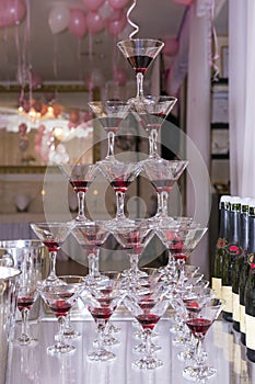 Pyramid of glasses of champagne and cherries, glass