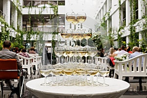 Pyramid of glasses with sparkling wine.