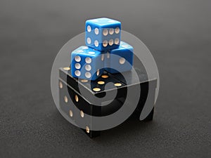 A pyramid made of dice and dominoes.