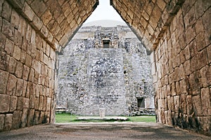 View from nunnery gate to the pyramid of magician, The ancient of mayan ruins in uxmal, Yucantan, Mexico