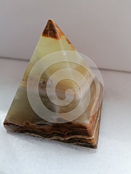 Pyramid of onix on white backround photo