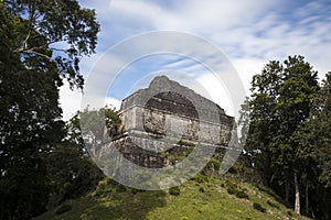 Pyramid partially overgrown in the Dzibanche Mayan complex in Mexico