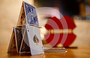 Pyramid of playing cards ace peak lady tambourine