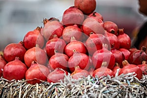 A pyramid of pomegranates at local farmers market