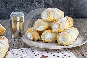 Pyramid of a puff pastry creme rolle with cream traditional Cze