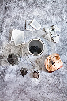 Pyramid and rectangle shaped tea bag mock up set on gray  background.  Or great black tea loose leaf. Eco-friendly alternatives