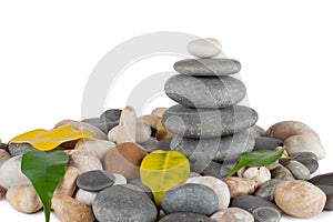 The pyramid of round stones with leaves