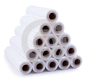 A pyramid stacked with rolls of stretch film on a white background. photo