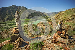 Pyramid of stones on a background of mountains