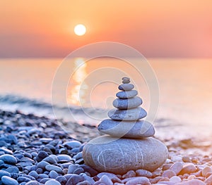 Pyramid of stones on sea coast