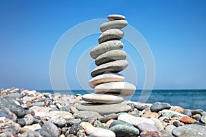 Pyramid of stones on the seashore. balance and harmony of life and rest