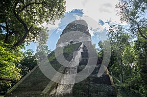 Pyramid and the Temple in Tikal Park. Sightseeing object in Guatemala with Mayan Temples and Ceremonial Ruins. Tikal is an ancient