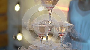 Pyramid tower of glasses with champagne. Sparkling alcohol wine at the party, celebration, wedding, birthday or