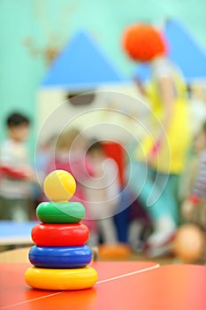 Pyramid toy stand at table in kindergarten