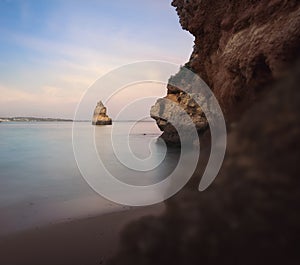 Pyramidal Rock at Praia do Camilo Beach at sunset - Long Exposure shot - Lagos, Algarve, Portugal