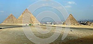 The Pyramids of Giza with Cairo in the background - Egypt photo