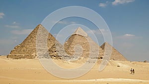 Pyramids of giza and two camels at cairo, egypt
